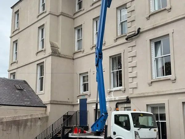 Emergency roof repair by the chimney stacks of a Melrose hotel