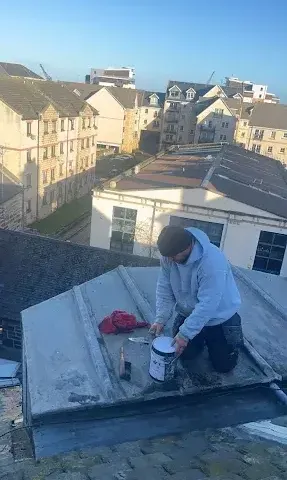 Roof tile repair work on a stone-built property in the Borders