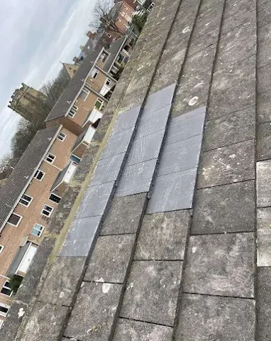 Slate roof repair work on a stone-built property